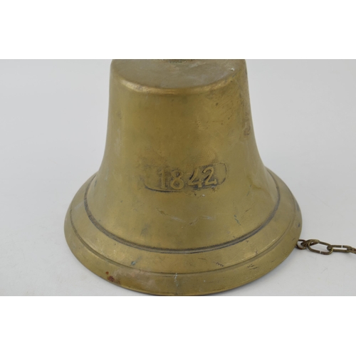 561 - A reproduction cast brass ships bell with date 1842. Height 18cm.