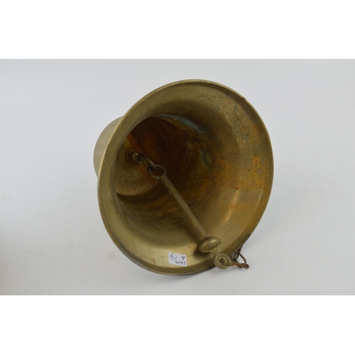 561 - A reproduction cast brass ships bell with date 1842. Height 18cm.