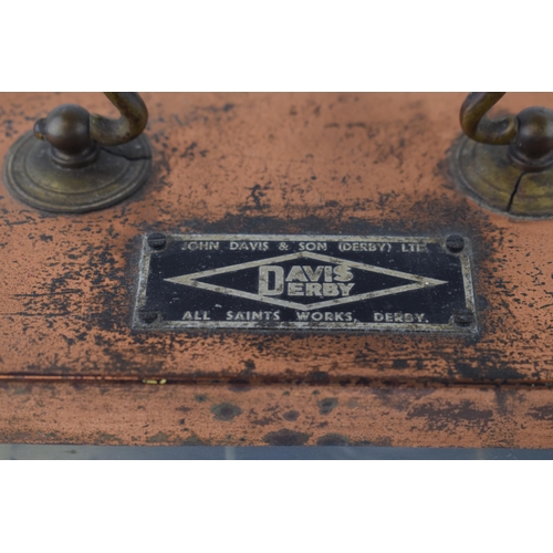 566 - John Davis & Son (Derby) Ltd. 'Davis Derby' Barograph in copper case. Height 17cm.