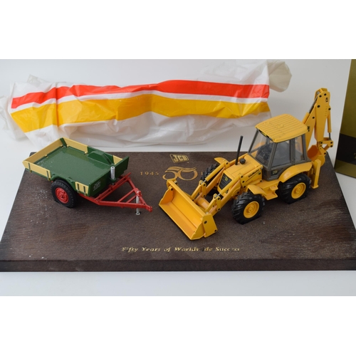 590 - JCB 'Fifty Years of Worldwide Success'  1945-1995 model of a Sitemaster and a trailer, 36cm wide wit... 