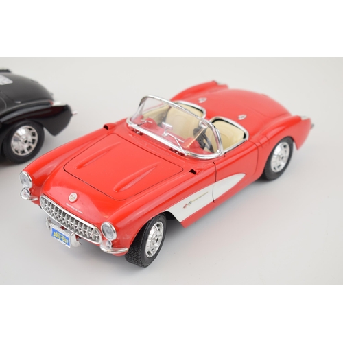 595 - Two Burago 1/18 scale Chevrolet Corvette (1957) one in red and one in black. (2)