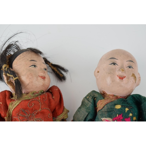 596 - A pair of Japanese dolls c1920s. Composite heads with hand-painted faces and hand-embroidered clothe... 