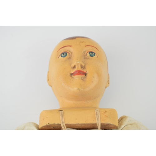 599 - Boy doll with wooden head and limbs, hand carved and hand-painted  head. c1970s. Height 54cm