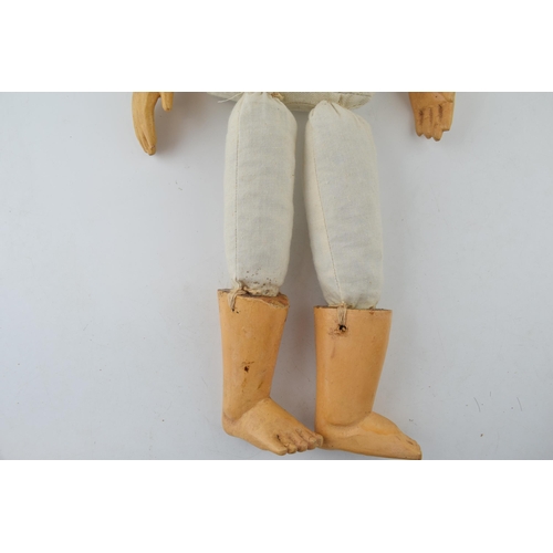 599 - Boy doll with wooden head and limbs, hand carved and hand-painted  head. c1970s. Height 54cm