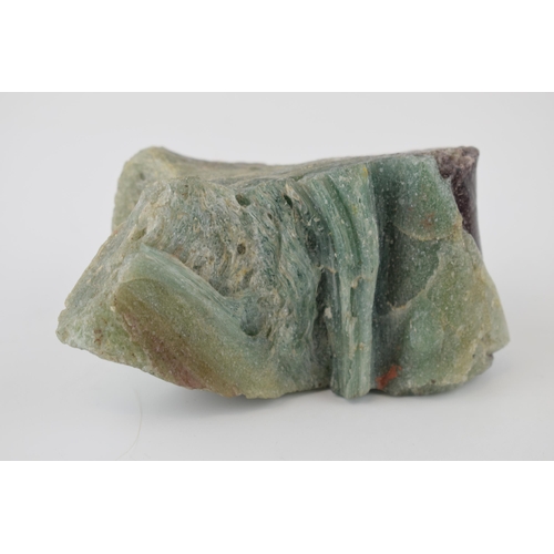 622 - A specimen of volcanic glass / fluorite in green and purple. Dimensions 13cm x 7cm x 8cm. Weight 556... 