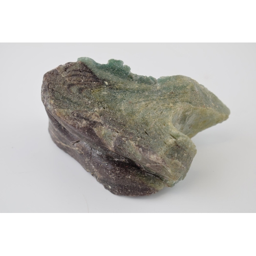 622 - A specimen of volcanic glass / fluorite in green and purple. Dimensions 13cm x 7cm x 8cm. Weight 556... 