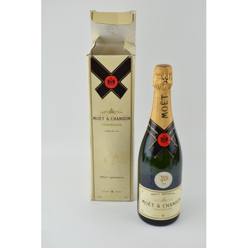 628 - A bottle of Moet Brut Imperial Champagne awarded to JCB workers for the 50th anniversiary in origina... 