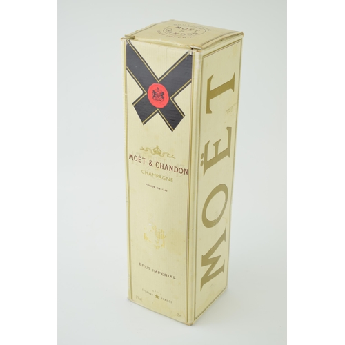 628 - A bottle of Moet Brut Imperial Champagne awarded to JCB workers for the 50th anniversiary in origina... 