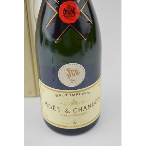 628 - A bottle of Moet Brut Imperial Champagne awarded to JCB workers for the 50th anniversiary in origina... 