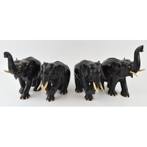 633 - A collection of vintage ebony hand carved elephants. (4)