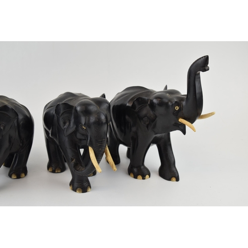 633 - A collection of vintage ebony hand carved elephants. (4)