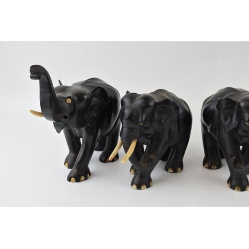 633 - A collection of vintage ebony hand carved elephants. (4)