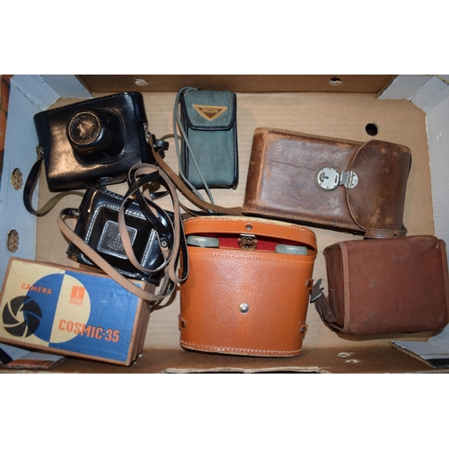 650 - A collection of vintage cameras and binoculars to include a Zorki - 4 35mm camera with lens, an OMO ... 