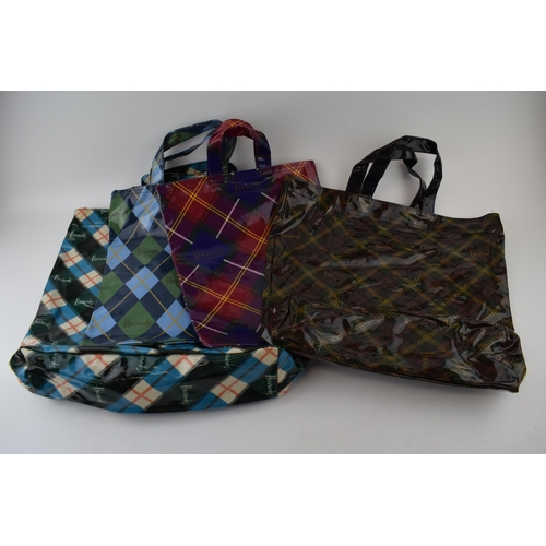 660 - A collection of 'Harrods' new old stock vintage shopper bags in tartan colour-ways. With original ta... 