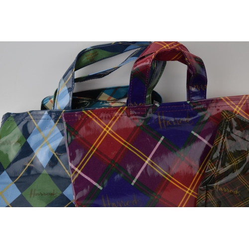 660 - A collection of 'Harrods' new old stock vintage shopper bags in tartan colour-ways. With original ta... 