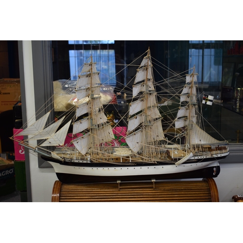 581 - Kit built model of a sailing vessel / galleon, with German flag, mounted onto wooden stand, mostly i... 