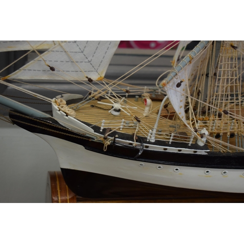 581 - Kit built model of a sailing vessel / galleon, with German flag, mounted onto wooden stand, mostly i... 