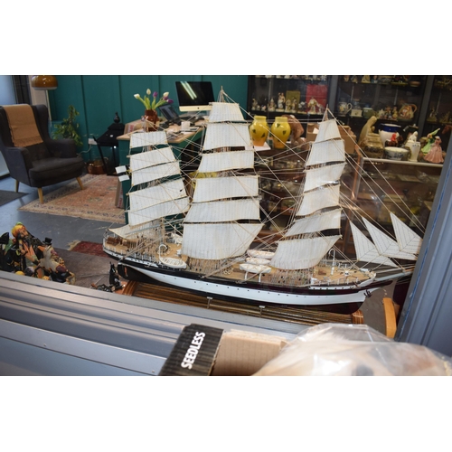 581 - Kit built model of a sailing vessel / galleon, with German flag, mounted onto wooden stand, mostly i... 