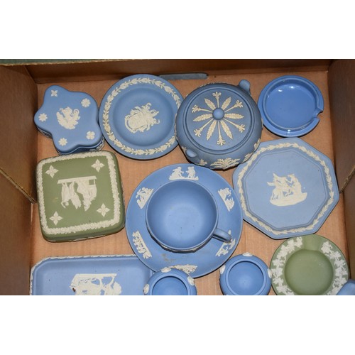 261 - A collection of Wedgwood Jasperware items in blue and green to include pin trays lidded pots, teapot... 