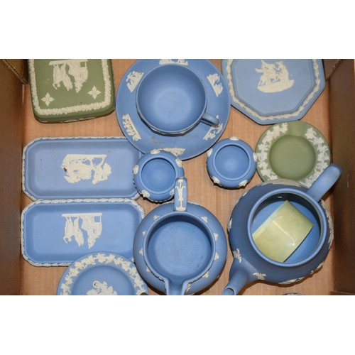 261 - A collection of Wedgwood Jasperware items in blue and green to include pin trays lidded pots, teapot... 