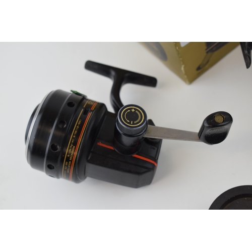 654 - Two Daiwa Harrier 120M Graphite Match reels, close face, one in original box. (2)