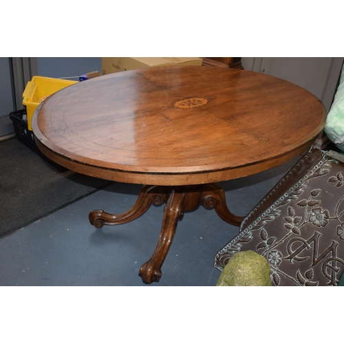 81 - Victorian quarter veneered burr walnut oval table with ornately carved legs on casters, satinwood in... 