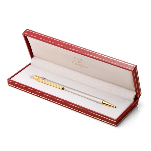 136 - Must de Cartier Ballpoint-Pen, with brushed finish and gilt-metal highlights, serial number C19272, ... 