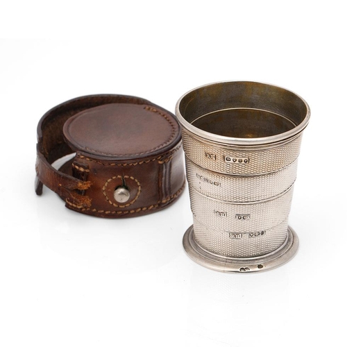 222 - Victorian silver collapsible cup, vacant cartouche, and with engine turned decoration, in original l... 