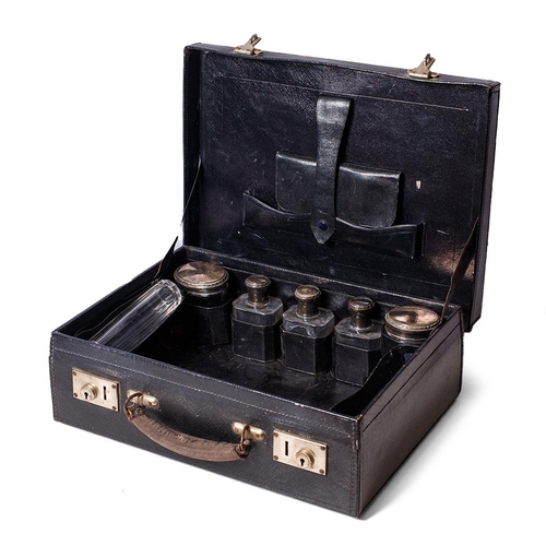 228 - A leather cased travelling case to include 6 silver topped jars of varying sizes and forms with indi... 