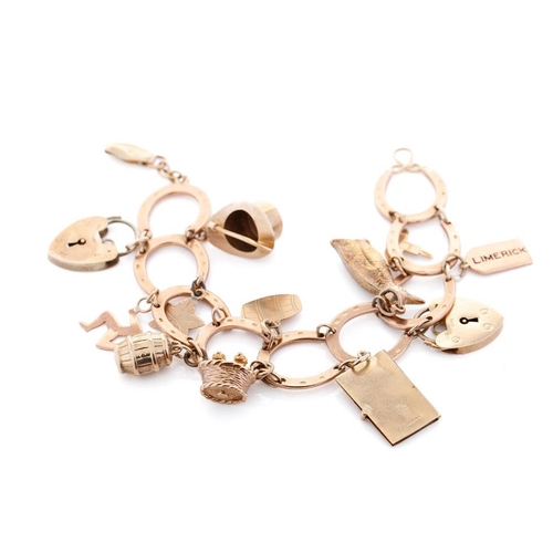 350 - 9ct rose gold horseshoe themed charm bracelet  and containing 12 x 9ct charms, including padlock.  W... 