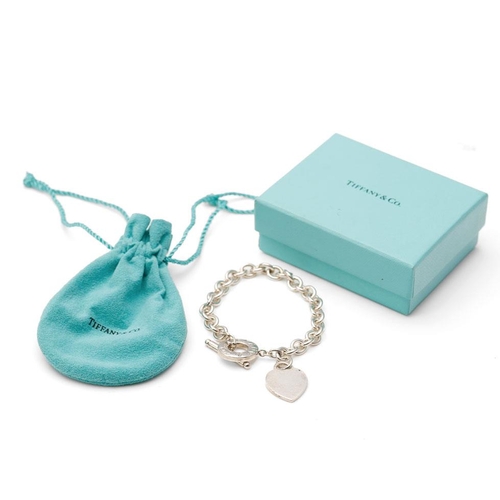 366 - Boxed Tiffany & Co bracelet with heart shaped fob and T-bar, 39.0 grams, 21.5cm long.