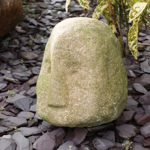 87 - Antique carved stone head weathered with distinctive nose, freestanding, 26cm tall.