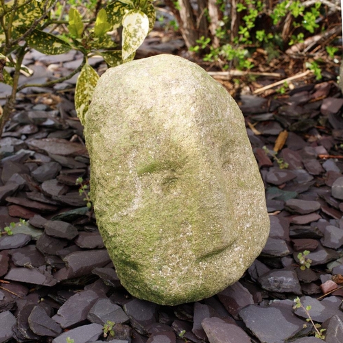 87 - Antique carved stone head weathered with distinctive nose, freestanding, 26cm tall.