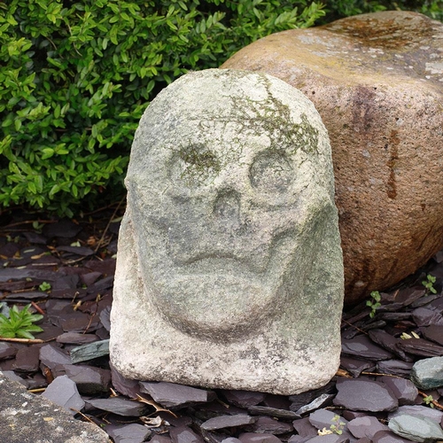 88 - Antique Carved Stone Head in the style of a skull weathered with signs of age and wear an unusual an... 