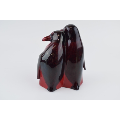 12 - Royal Doulton flambe pair of huddling penguins 109, 15cm tall.