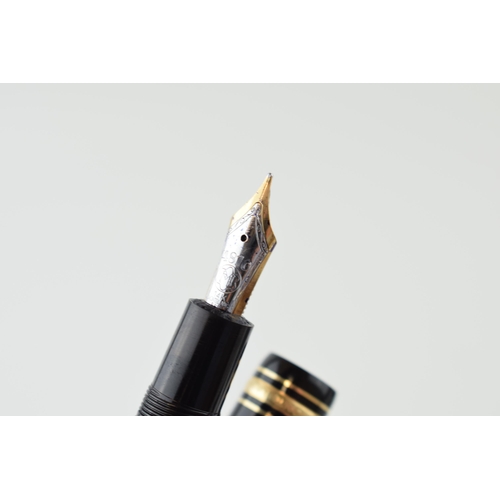 134 - A Montblanc Meisterstuck 146 Fountain Pen in black with one broad and two narrow gold bands, 14ct bi... 