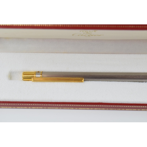 136 - Must de Cartier Ballpoint-Pen, with brushed finish and gilt-metal highlights, serial number C19272, ... 