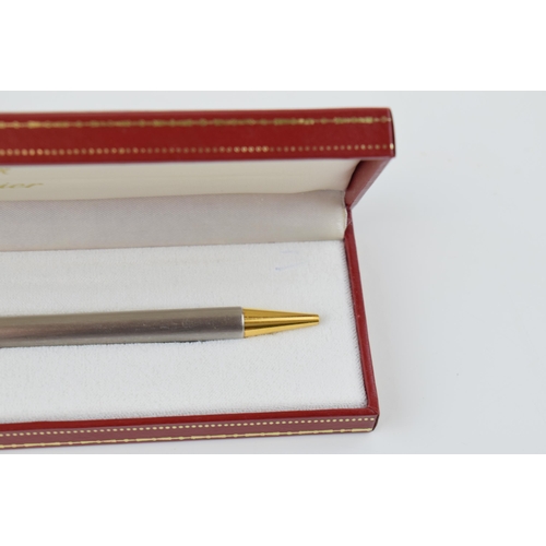 136 - Must de Cartier Ballpoint-Pen, with brushed finish and gilt-metal highlights, serial number C19272, ... 