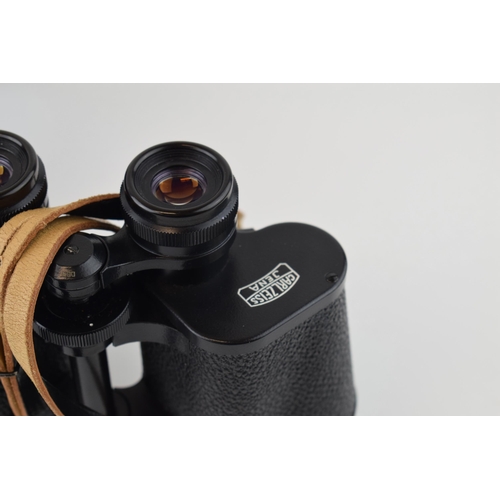 137 - A cased pair of Carl Zeiss Jena Jenoptem 10x50 binoculars.