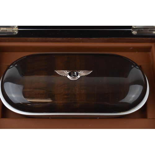 138 - A rare 'Bentley Motors' glasses case in presentation box in burr walnut and aluminium with leather l... 