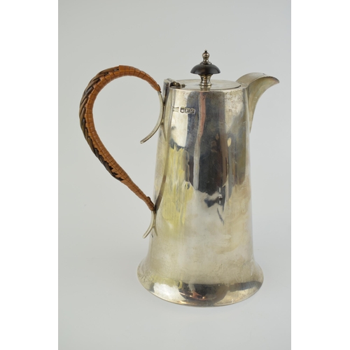 192 - Hallmarked sterling silver coffee pot with ebonised finial and wicker handle, Walker and Hall, Sheff... 