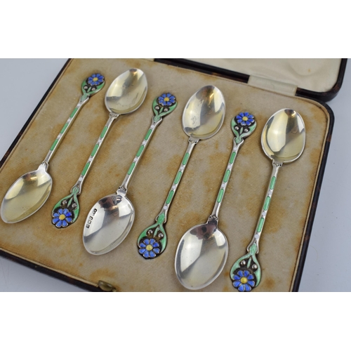 208 - A stunning cased set of hallmarked silver tea spoons with enamelled decoration in the form of flower... 