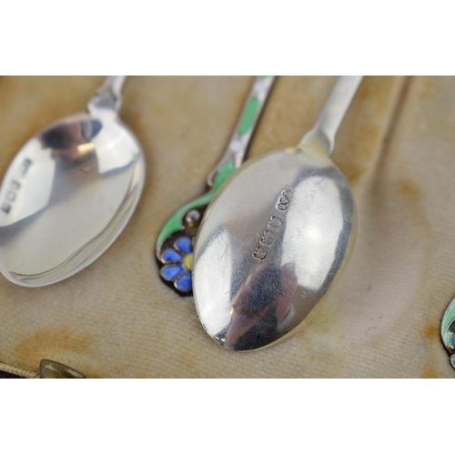 208 - A stunning cased set of hallmarked silver tea spoons with enamelled decoration in the form of flower... 