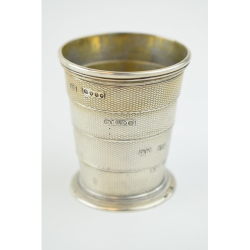 222 - Victorian silver collapsible cup, vacant cartouche, and with engine turned decoration, in original l... 