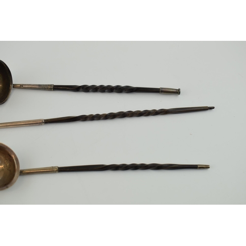 223 - A trio of silver toddy ladles with twist effect handles, unmarked, longest 25.5cm (3).