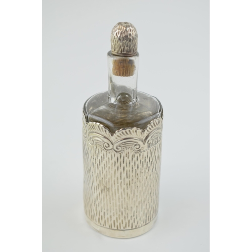 238 - Silver cased glass perfume bottle with silver and cork stopper, Birm 1900, AWP, 14cm tall.