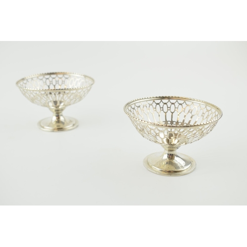 243 - A pair of silver bon bon dishes with ornate pierced decoration, Birm 1921, E S Barnsley, 76.8 grams ... 