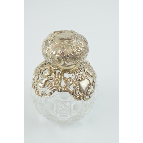 244 - Silver mounted globular perfume bottle, Chester 1900, 10.5cm tall, with glass stopper.