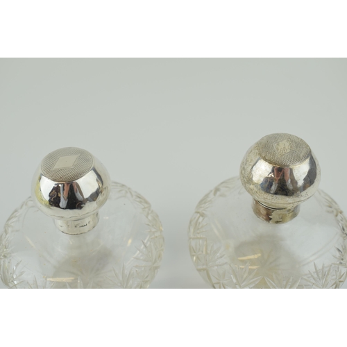 248 - A pair of matching silver topped cut glass perfume bottles, Birm 1923, Levi & Salaman (2), 10cm tall... 