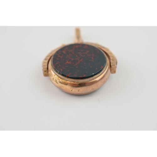 297 - 9ct (marked 10c) bloodstone fob with compass to reverse, probably American, 12.8 grams gross weight.